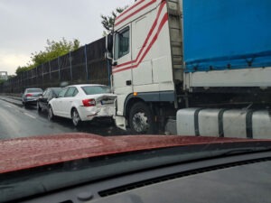 A Virginia Beach truck accident lawyer witnesses a truck hitting a passenger car.