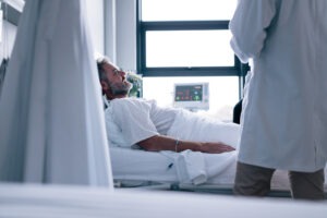 A Virginia Beach spinal cord injury lawyer visiting a client in the hospital.